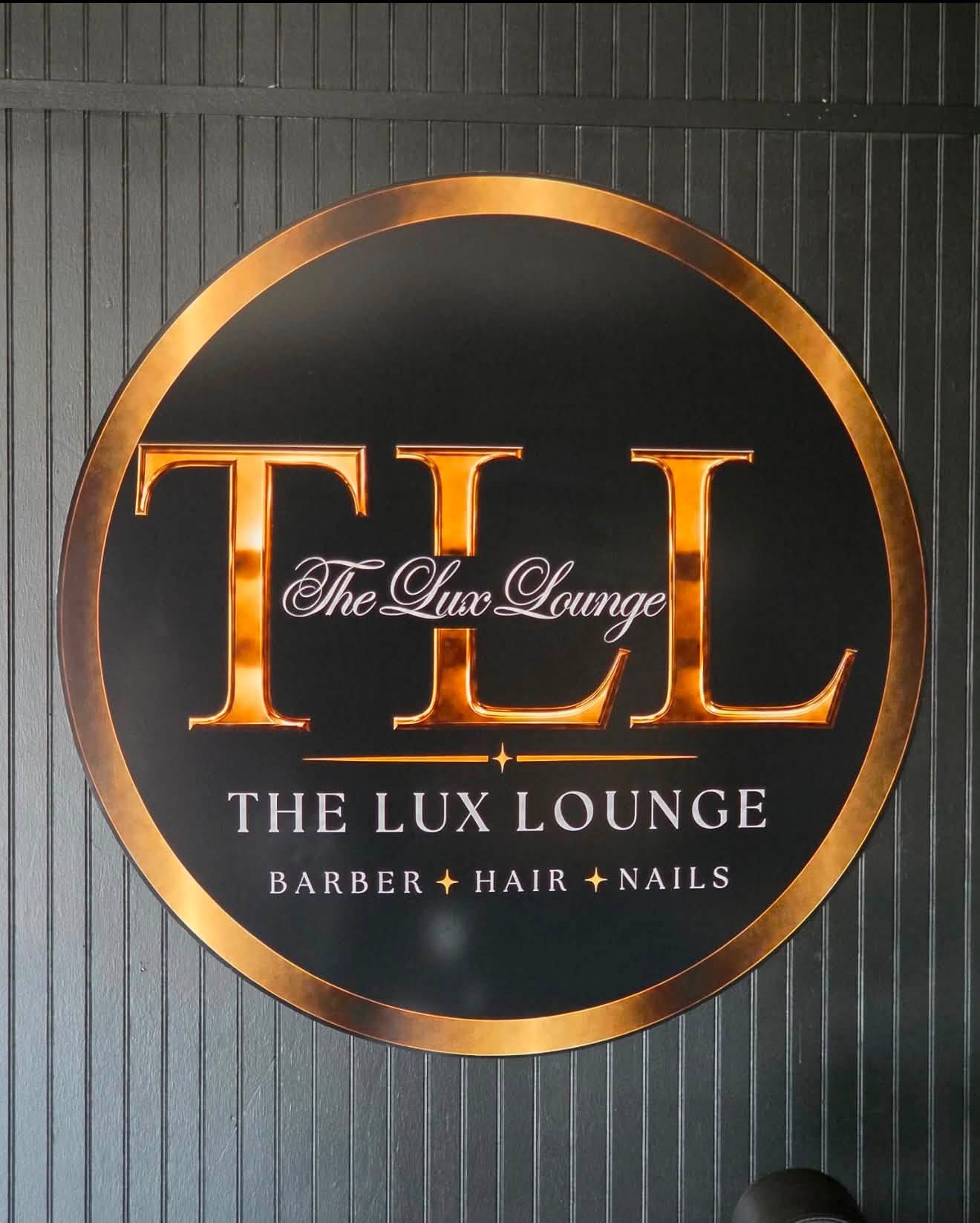 The Lux Lounge black and gold wall sign